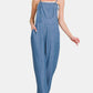 Model showcasing Zenana washed adjustable strap wide leg denim overalls in a relaxed fit, perfect for casual style.