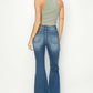 Woman wearing Risen high rise front seam detailed flare jeans, back view showcasing stylish vintage-inspired design.