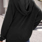 Woman wearing textured kangaroo pocket long sleeve hoodie in black, back view showing hood detail.