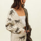 Woman wearing Open Front Long Sleeve Contrast Cardigan with zebra print, featuring an open front design and long sleeves for a chic look.