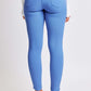 Woman wearing YMI Jeans Hyperstretch Mid-Rise Skinny Pants in vibrant blue, showcasing a flattering back view.