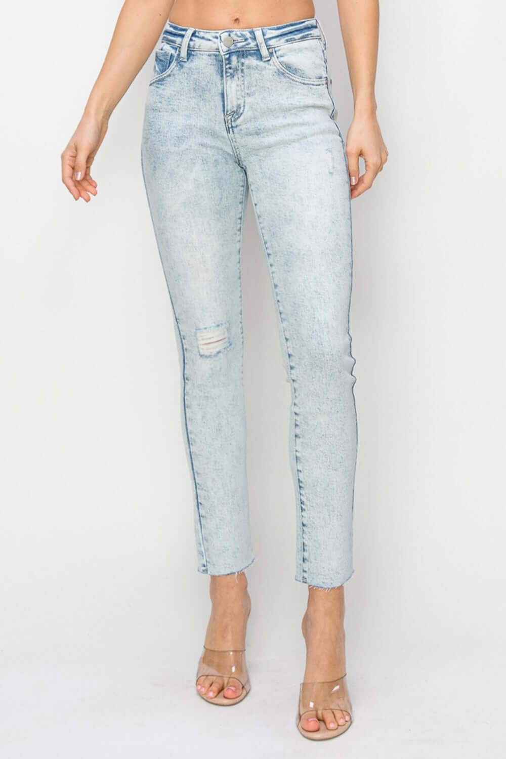 High rise distressed skinny jeans by Risen Jeans with cool ripped details and a flattering fit, perfect for casual or dressy occasions.