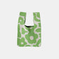 Green and white flower eco-friendly knitted handbag with artisanal texture and spacious interior