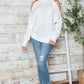 Cozy Bella Road cable-knit turtleneck cold shoulder sweater, perfect for chilly days with trendy cut-out shoulder design.