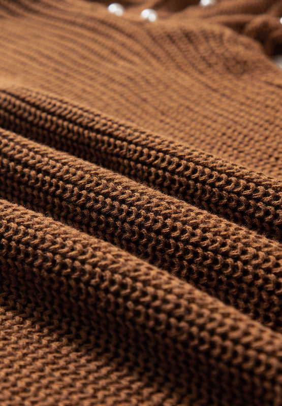 Close-up of Bella Road Pearl Detail Sweater fabric showcasing rich texture in brown with subtle pearl accents.