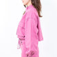 Stylish pink cropped worker jacket with drawstring hem and cargo pockets, perfect for a trendy and utilitarian look.