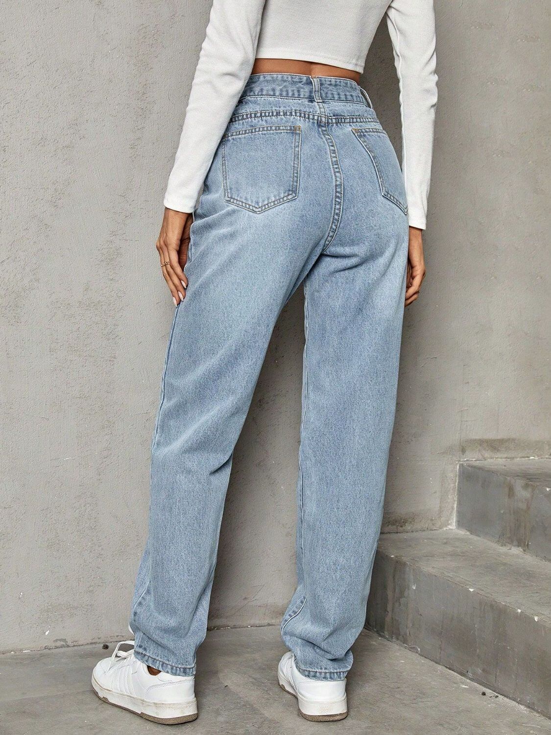 Woman wearing Bella Road Asymmetric Waist Jeans with Pockets, showing back view of stylish, comfy denim with plush lining.