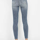 Judy Blue full size tummy control contrast wash skinny jeans back view showcasing sleek design and flattering fit.