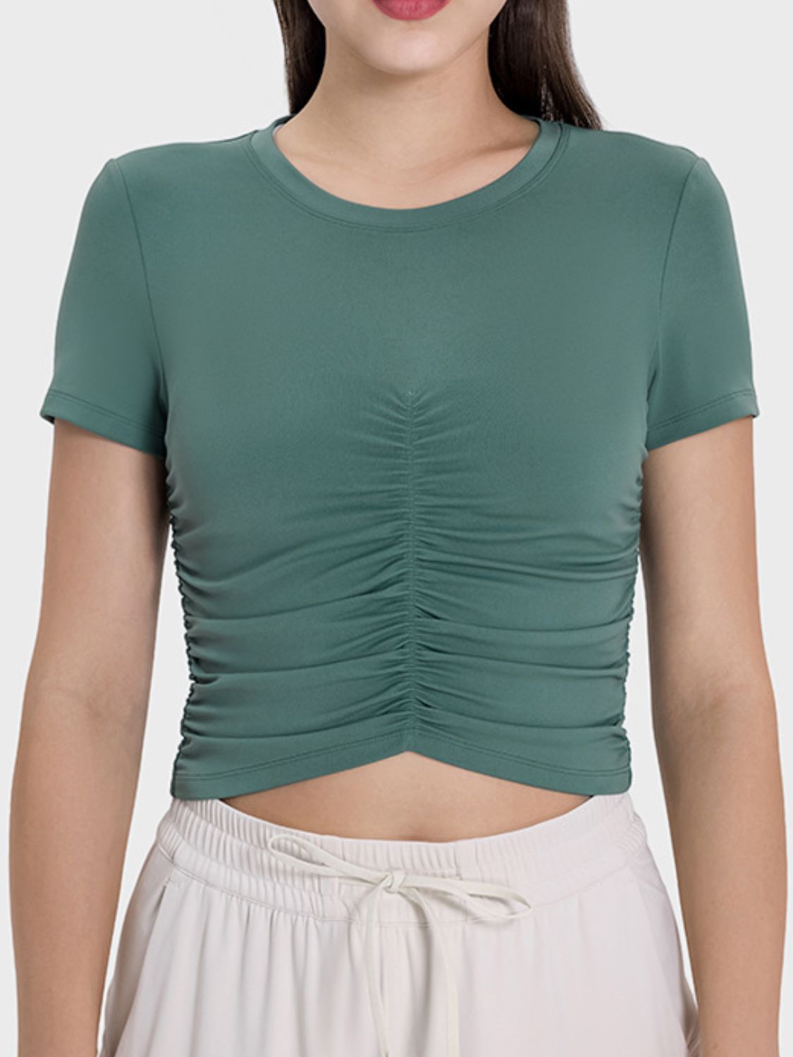 Stylish dark green ruched short sleeve active t-shirt, perfect for workouts or casual wear.