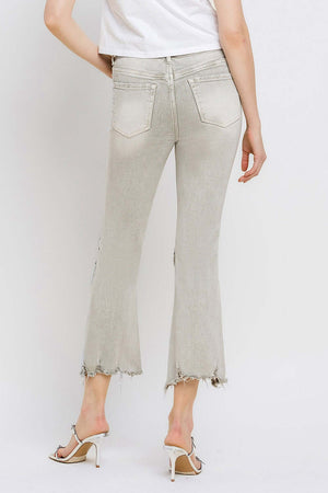 Lovervet distressed raw hem cropped flare jeans with urban flair and trendy unfinished edge, shown from the back.