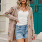 Woman wearing Angel Wings Star Open Front Long Sleeve Cardigan, embracing cozy chic style with a playful twist.