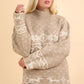 Cozy mock neck sweater with festive reindeer and snowflake patterns, perfect for winter warmth and holiday style.