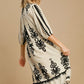 Umgee Printed Notched Midi Dress with black print, stylish notched neckline, and chic cowboy hat for a trendy look.