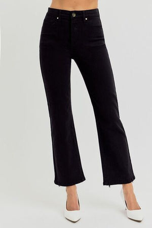 Model wearing RISEN Plus Size High Rise Tummy Control Crop Straight Jeans in black for a chic, flattering look.