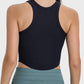 Back view of the Millennia Round Neck Racerback Active Tank, featuring a sleek black design and ribbed texture.