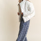 J.NNA Quilted Mock Neck Puffer Jacket in white, styled with denim pants, showcasing a chic and cozy look for chilly days.