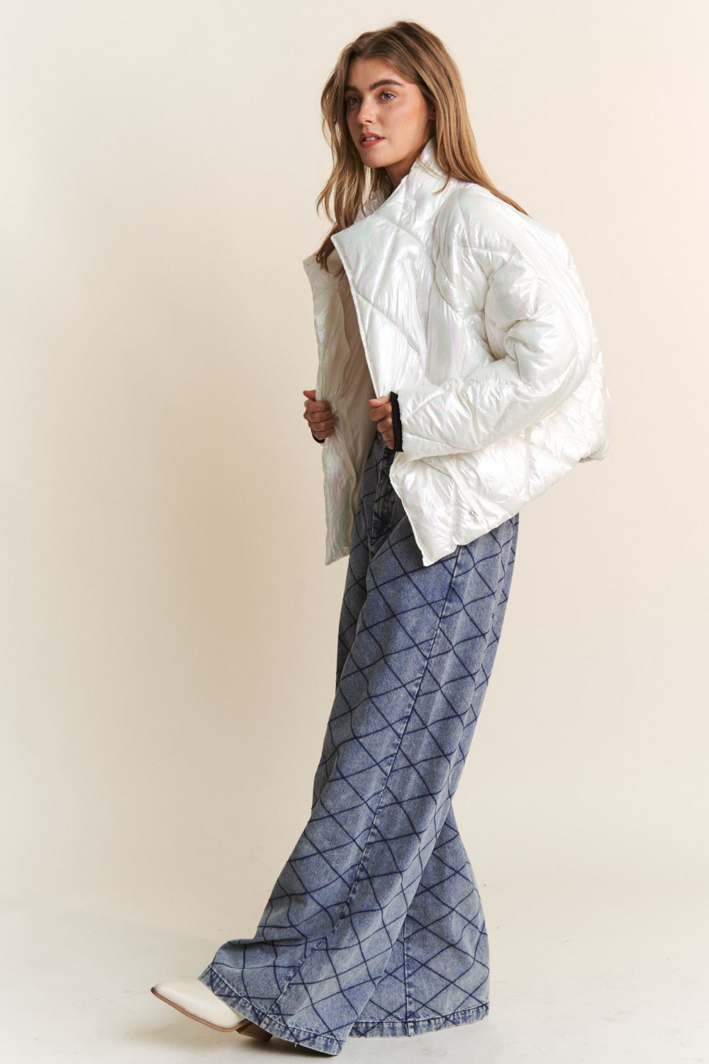 J.NNA Quilted Mock Neck Puffer Jacket in white, styled with denim pants, showcasing a chic and cozy look for chilly days.