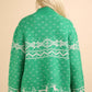 Cozy green Christmas sweater with snowflake and reindeer patterns, featuring a festive mock neck and long sleeves for holiday cheer.