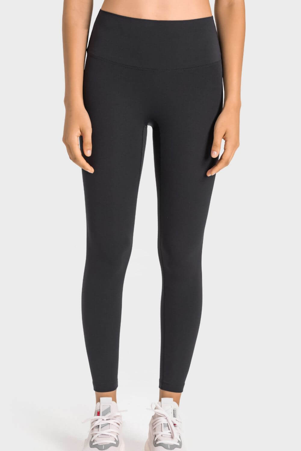 Millennia High-Rise Yoga Leggings in black, showcasing wide waistband and sleek fit for yoga practice.