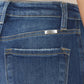 Raw Hem High Waist Cropped Jeans - back pocket close-up showing trendy raw hem details and stitching on blue denim.