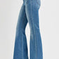 Side view of RISEN Full Size Front Patch Pocket Flare Jeans showcasing a retro flared leg design and stylish pockets.