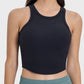 Millennia Round Neck Racerback Active Tank in black, featuring a stylish cropped design and moderate stretch for active wear.