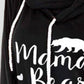 Close-up of a black Bella Road drawstring hoodie with letter graphic "Mama Bear" and bear silhouette. Long sleeve, slightly stretchy fabric.