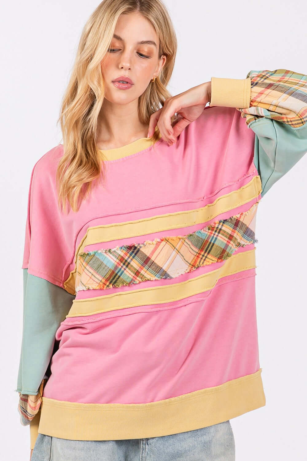 Woman wearing Mineral Wash Raw Edge Color Block Sweatshirt with plaid print contrast sleeves and front, stylish and comfortable fashion.