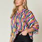 DOUBLE TAKE Full Size Geometric Notched Raglan Sleeve Blouse at Bella Road