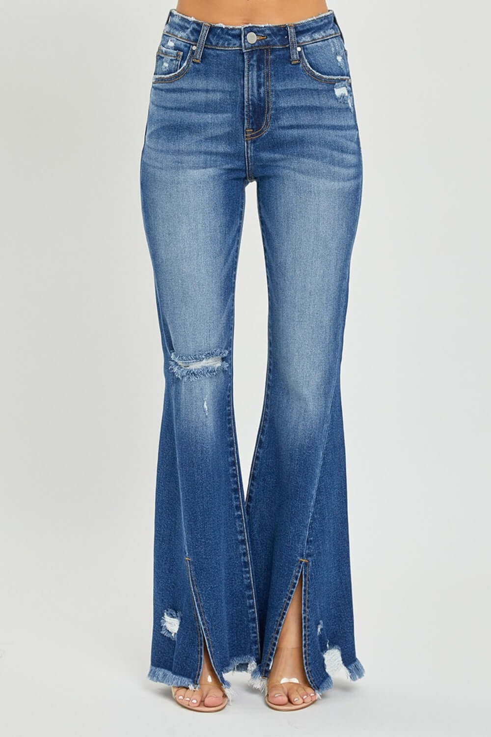 High Rise Front Slit Frayed Hem Flare Jeans by Risen Jeans with edgy front slit and retro flared silhouette for a trendy, casual look.