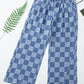 Bella Road Checkered Wide Leg Jeans with pockets on white background, showcasing unique checkered pattern and spacious pockets.