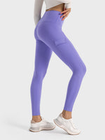 Millennia Wide Waistband Sports Leggings in lilac, showcasing a stylish pocket and perfect stretch for workouts.