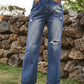 Bella Road Distressed Jeans with Pockets in Navy, featuring edgy rips and a stylish look, perfect for versatile fashion.