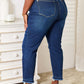 Woman wearing High Waist Released Hem Slit Jeans in deep indigo wash, Judy Blue Jeans – back view showing flattering fit and stylish design