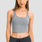 Millennia Racerback Sports Bra in sleek grey, perfect for yoga and workouts, offering comfort and style in a slim fit.