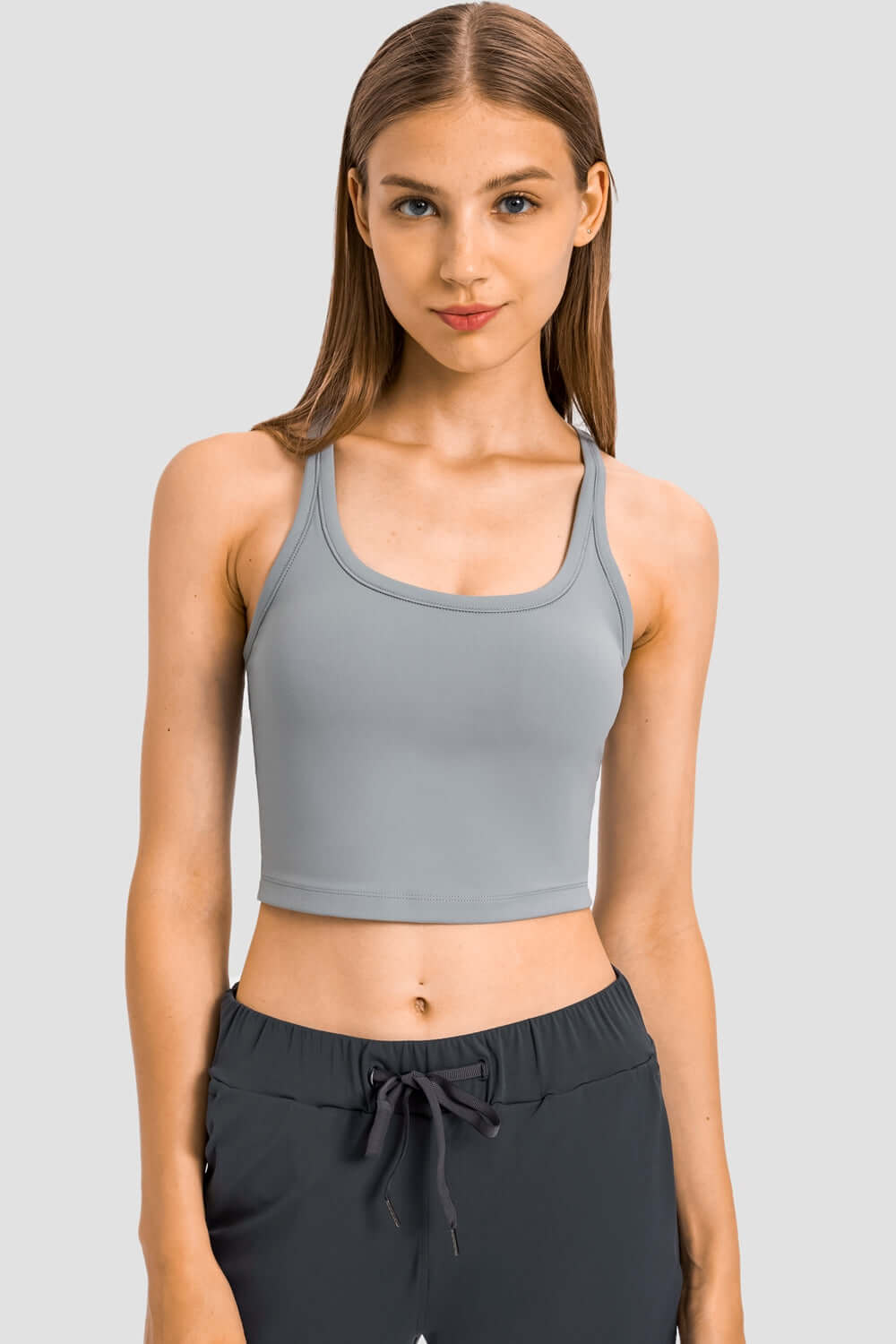 Millennia Racerback Sports Bra in sleek grey, perfect for yoga and workouts, offering comfort and style in a slim fit.