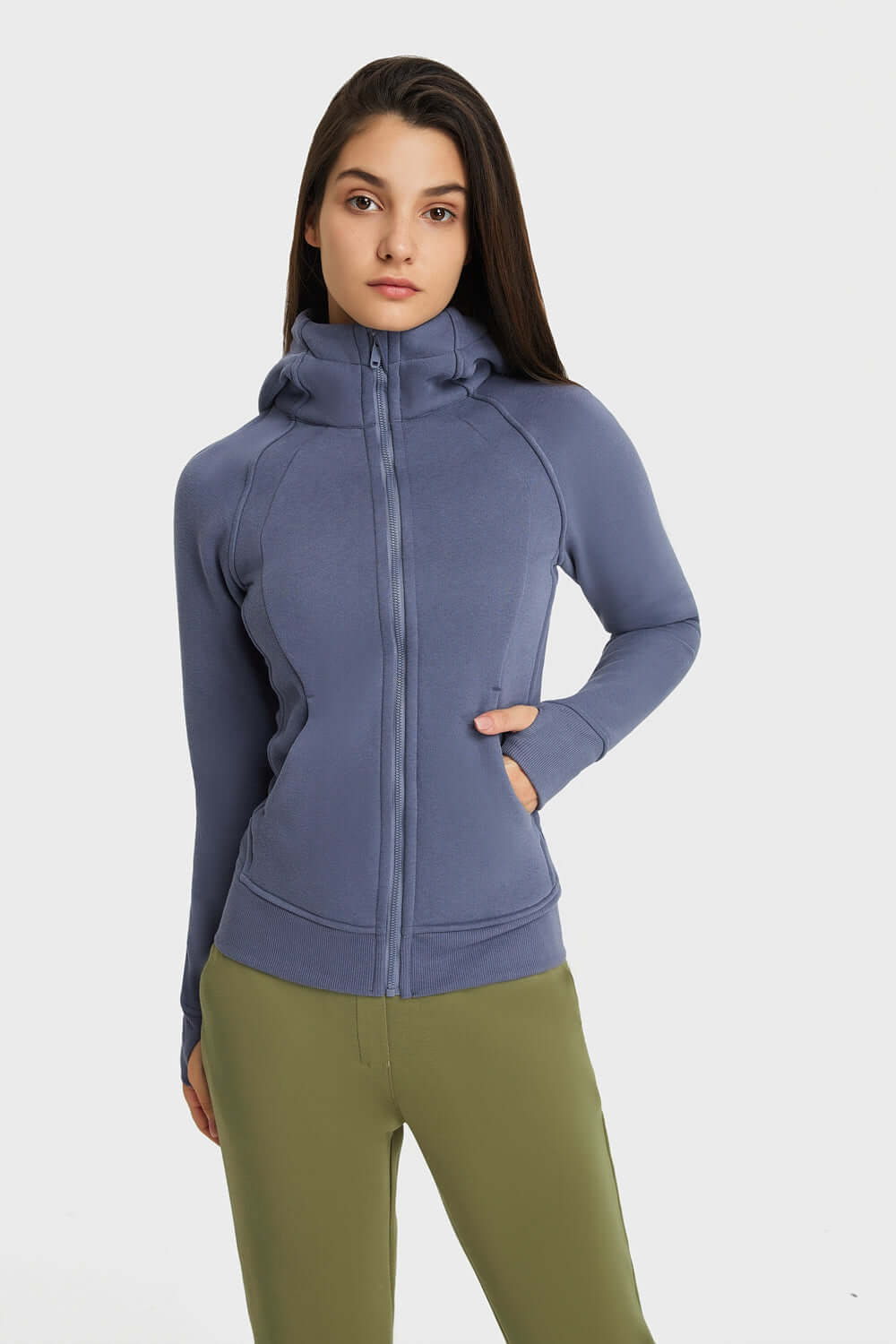 Model showcasing the Millennia Zip Up Seam Detail Hooded Sports Jacket in blue, perfect for outdoor activities and sporty style.