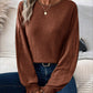 Woman wearing Bella Road ribbed round neck lantern sleeve t-shirt in brown with blue jeans.