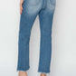 Back view of High Rise Slim Straight Risen Jeans in petite size with high heel shoes