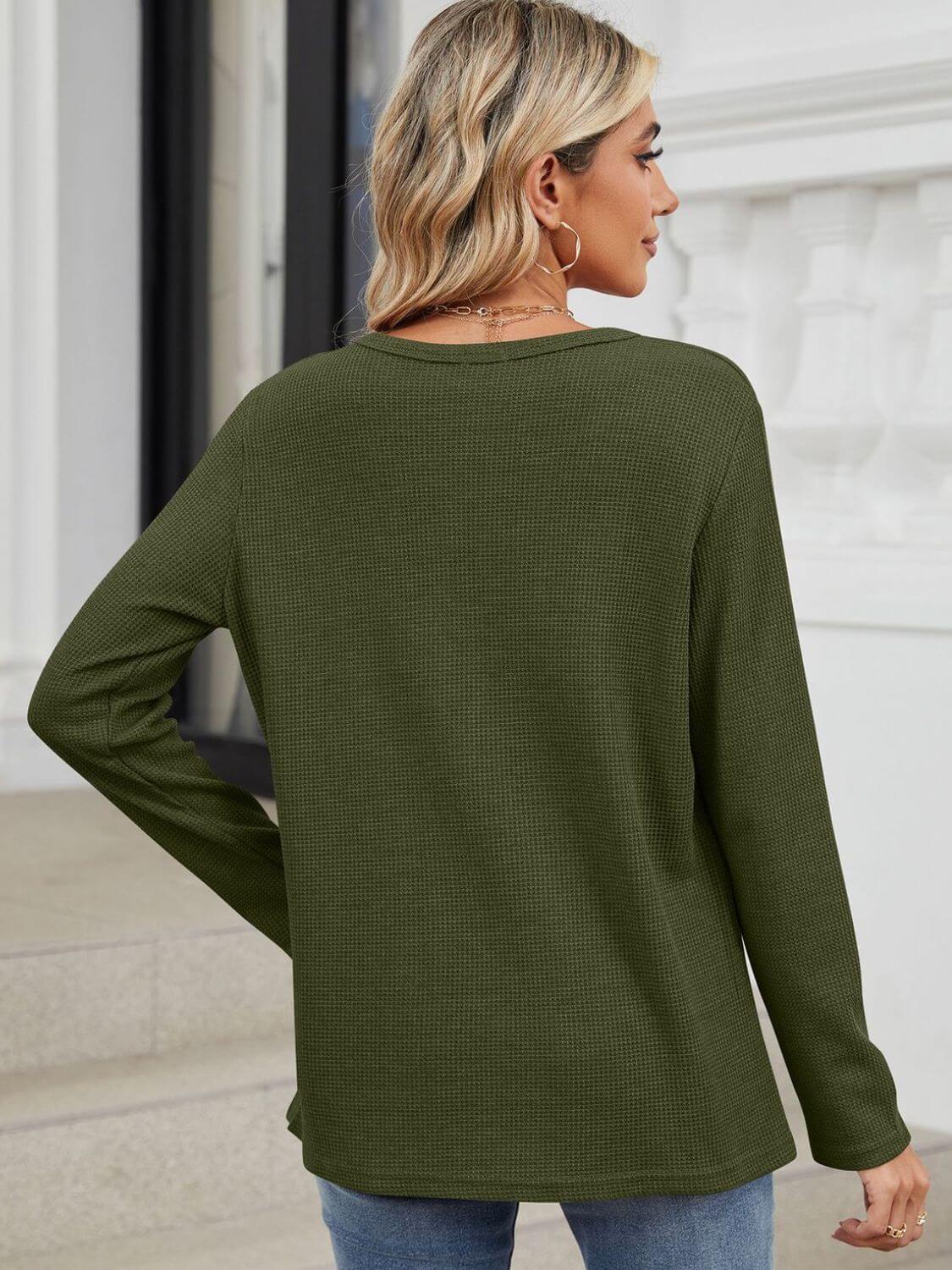 Woman wearing Bella Road Waffle-Knit Notched Long Sleeve T-Shirt in green from the back, showing its relaxed fit and basic style.