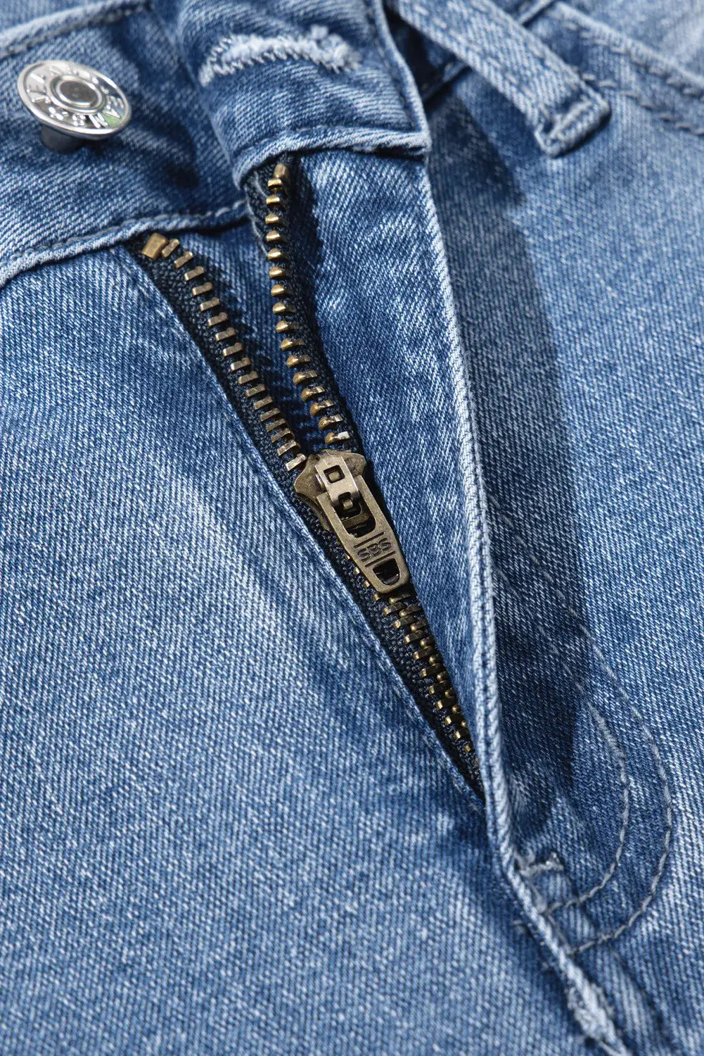 Close-up of Bella Road Raw Hem Wide Leg Jeans with Pockets showing zipper and button details.