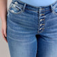 Judy Blue Plus Size Distressed Jeans with Button Fly and Pockets, stylish and perfect for casual wear.