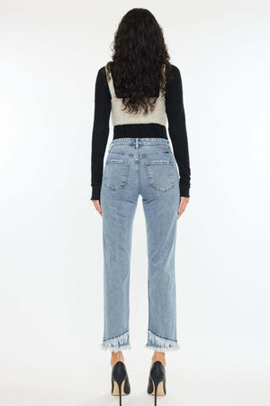 Woman wearing Raw Hem High Rise Straight Jeans in petite size, showcasing the back view and modern raw hem detailing.