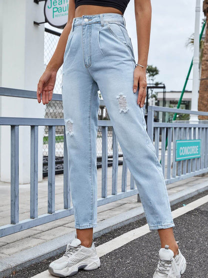 Woman wearing Bella Road distressed straight jeans with pockets in a street setting