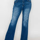 Stylish woman in bytos high rise bootcut jeans with pockets, perfect for a chic, flattering look.