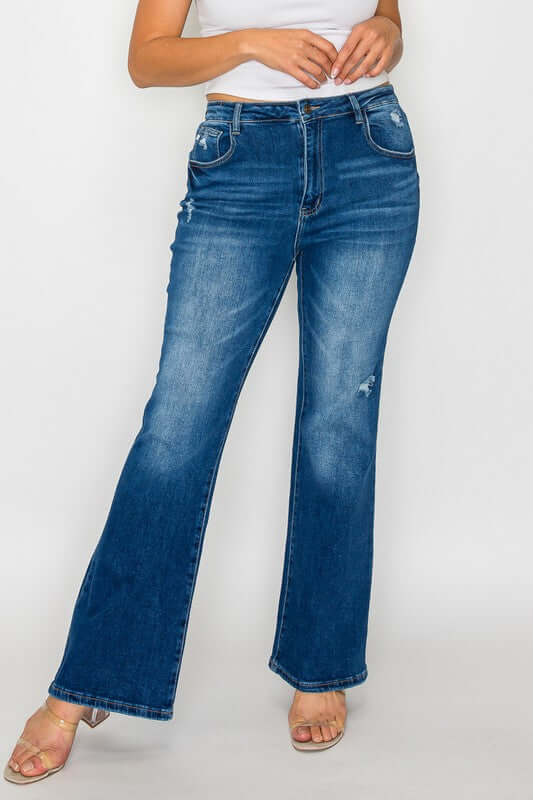 Stylish woman in bytos high rise bootcut jeans with pockets, perfect for a chic, flattering look.