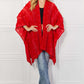 JUSTIN TAYLOR Pom-Pom Asymmetrical Poncho Cardigan in Red at Bella Road