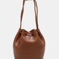 Nicole Lee USA Amy Studded Bucket Bag in brown vegan leather with drawstring closure