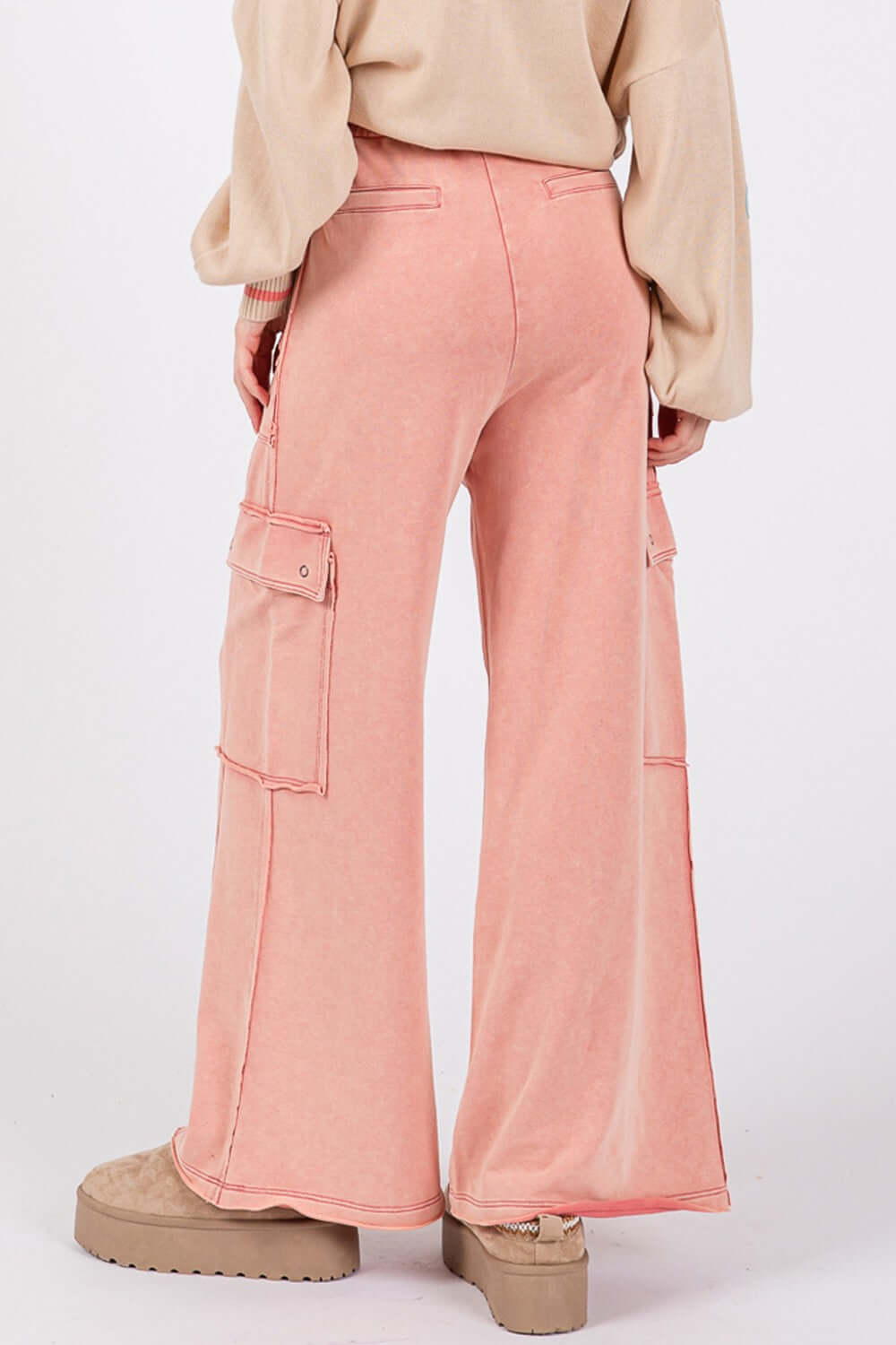 Knit Terry Mineral Wash Wide Leg Pants in soft pink with cargo pockets, shown from the back.