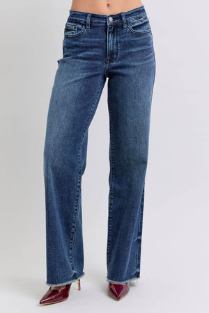 Judy Blue full-size raw hem mid-rise jeans in dark wash, featuring an edgy frayed bottom and flattering fit.